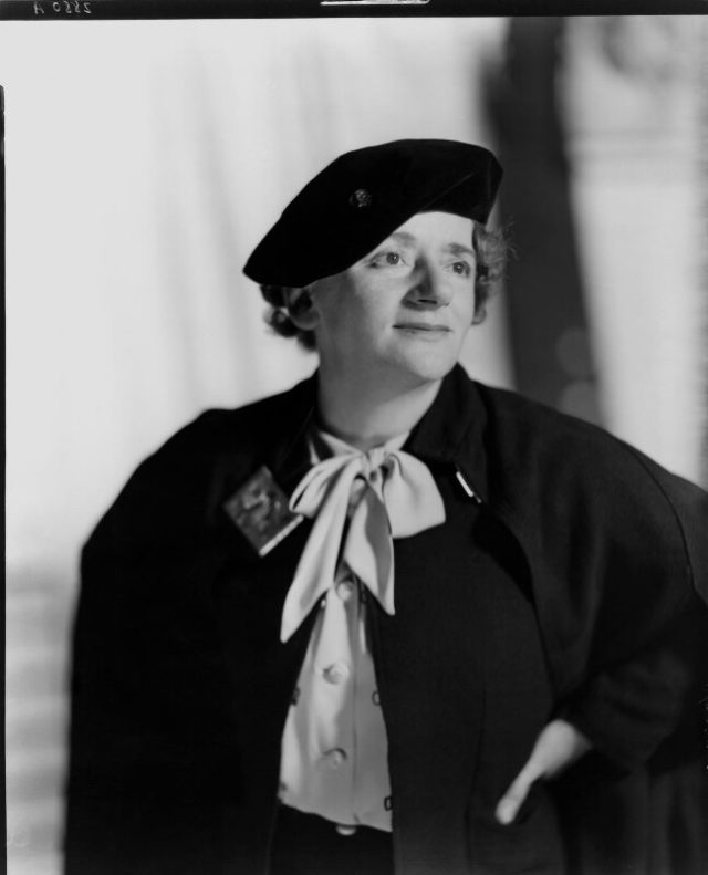 Portrait of Ellen Wilkinson wearing a black hat and coat