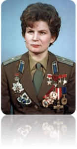 Portrait of a woman with dark hair wearing a green jacket and medals